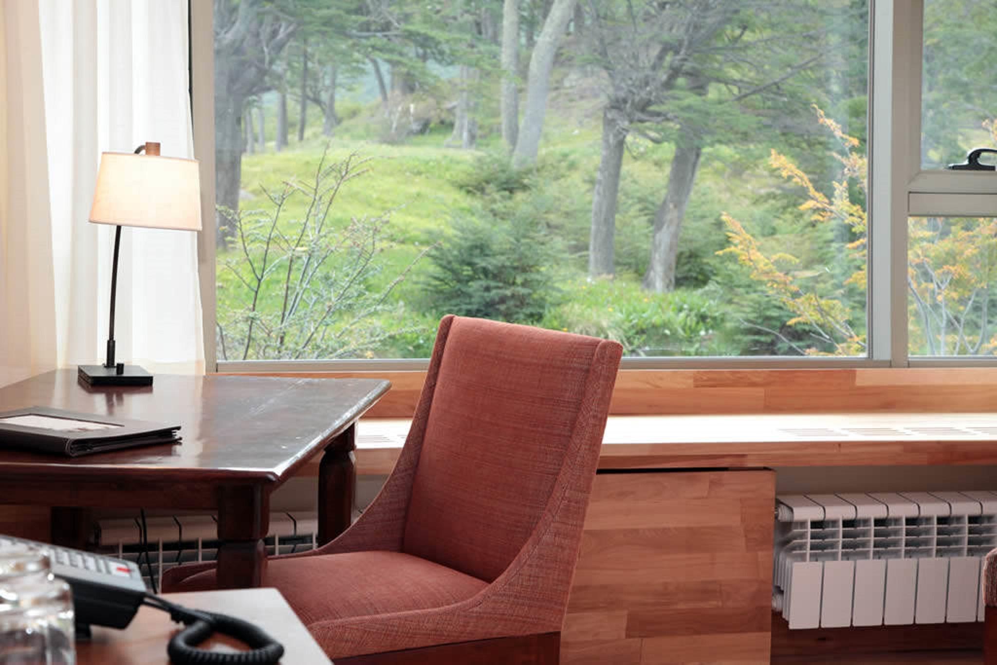 Arakur Ushuaia Resort & Spa Extérieur photo A view of the woods from the library